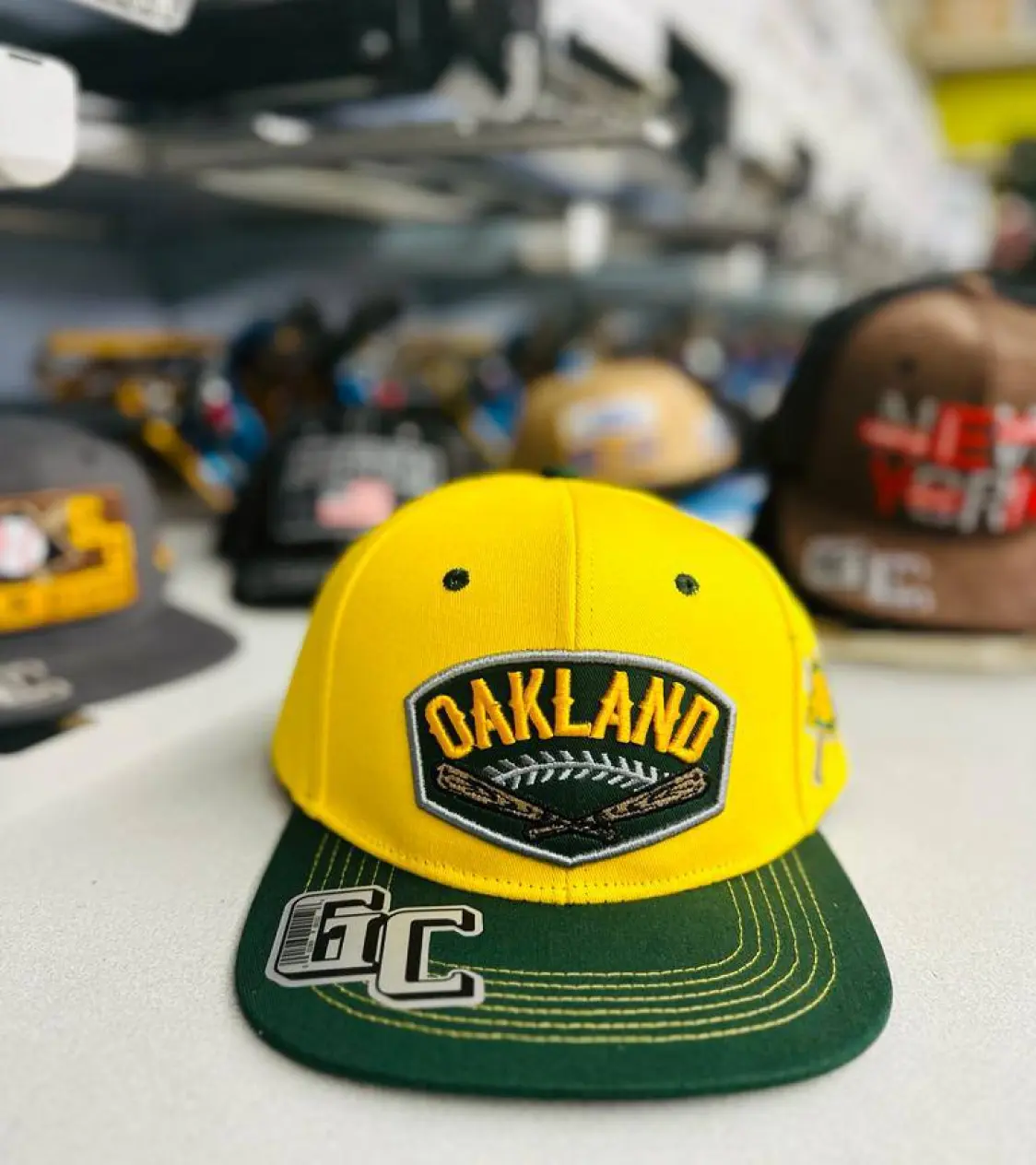 Yellow cap with Oakland print