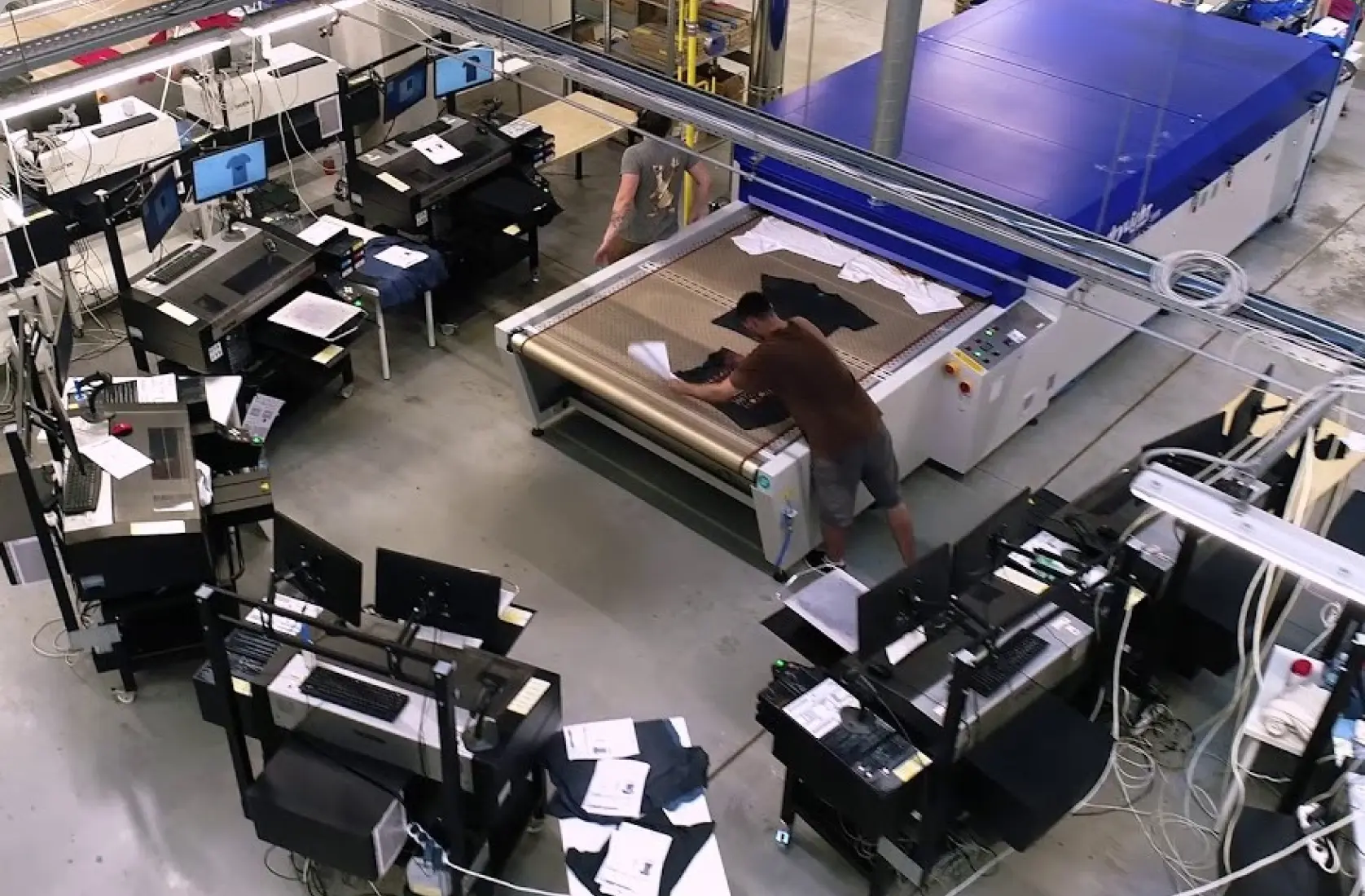 An overhead view of a factory with many machines.